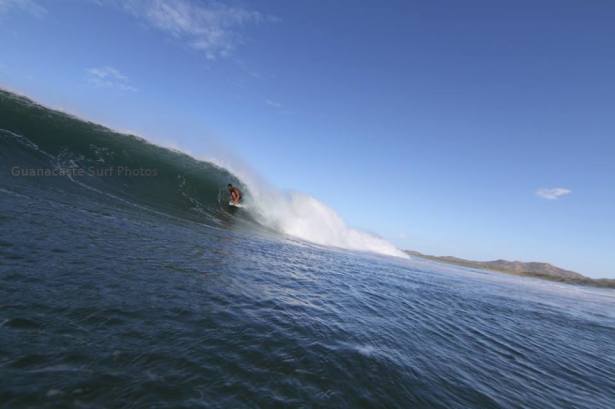 Author, Ryan Waldron, threading the needle on a Tamarindo Drainer. Photo - Guanacaste Surf Photos