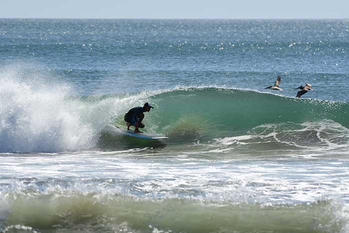 Crouching into a nice little tub at Las Palmeras, Playa Grande - surfing Costa Rica