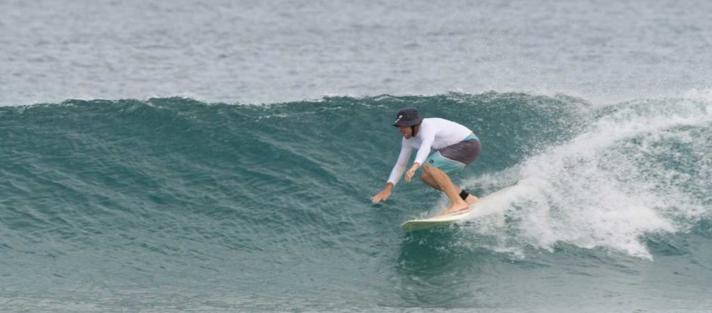 Surfing down the line at the Tamarindo beach break, Costa Rica