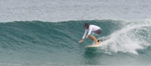 Surfing down the line at the Tamarindo beach break, Costa Rica
