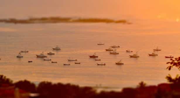 Tamarindo Bay sunset view from Mirador Mountain, Costa Rica with boats.